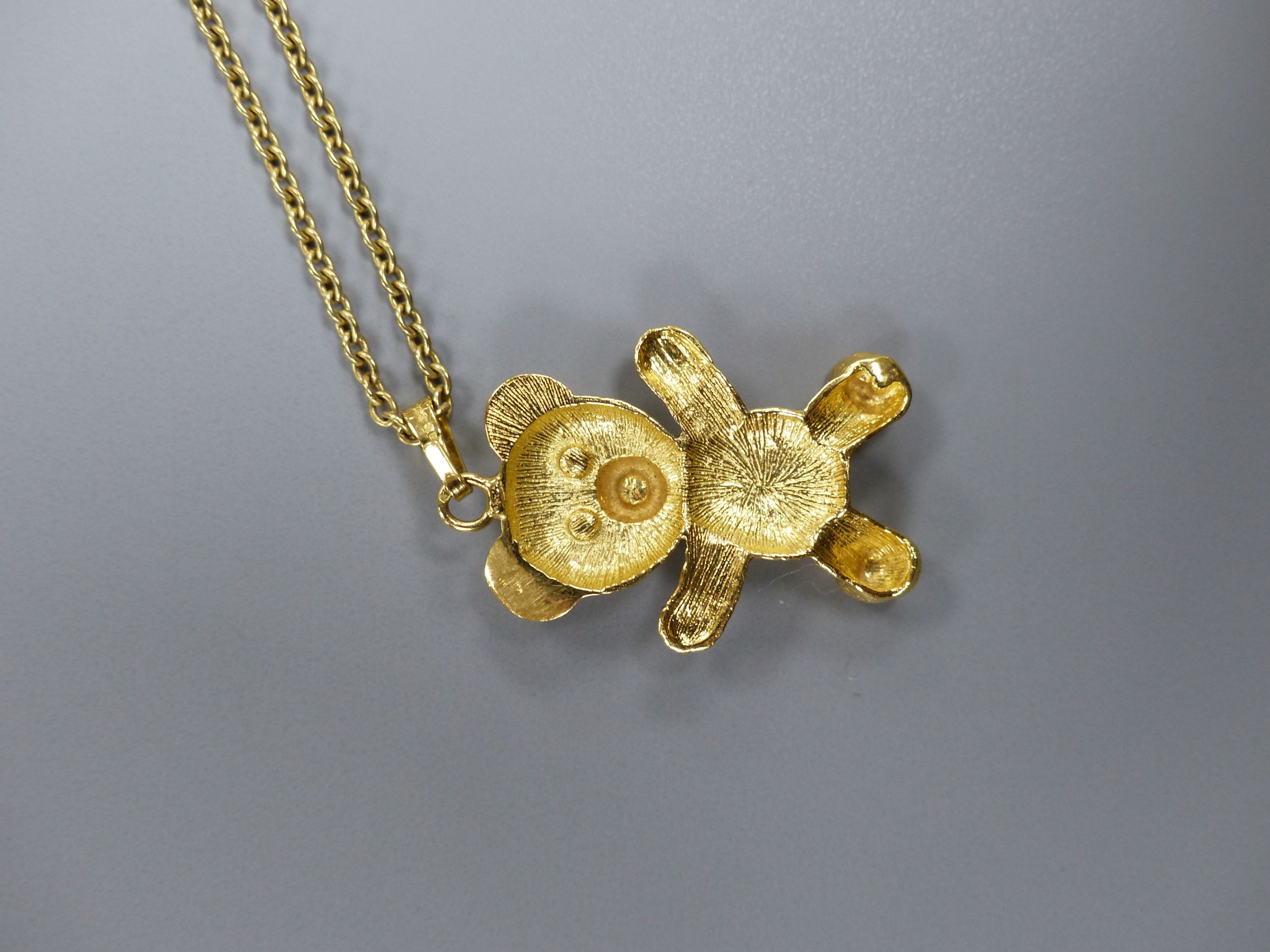 A modern 9ct gold and gem set teddy bear pendant, 26mm, on a 9ct chain, 41cm,